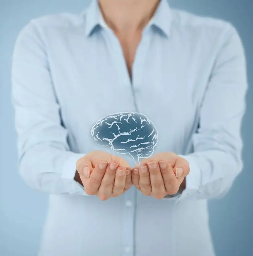 A woman holding out her hands with an image of a brain in front.